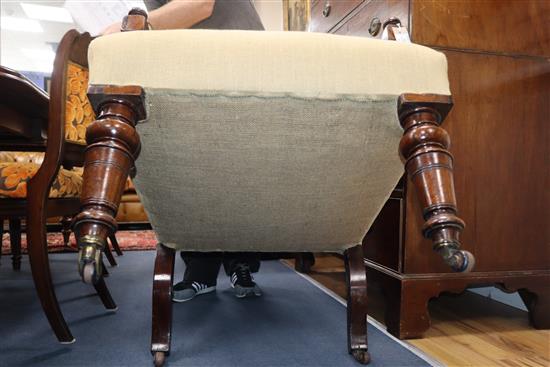 A Victorian rosewood upholstered wing armchair